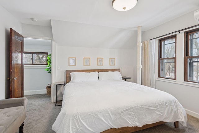 bedroom with lofted ceiling and carpet floors