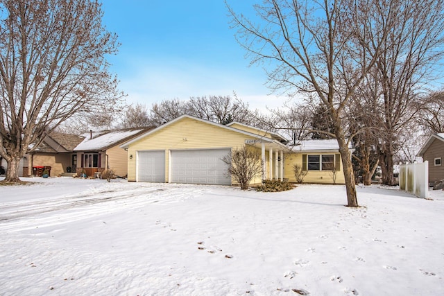 single story home featuring a garage