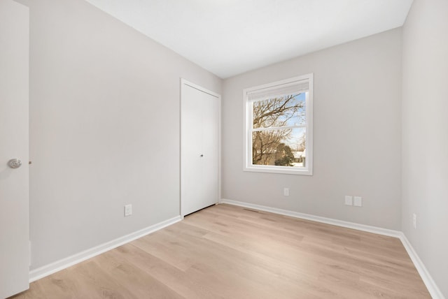 unfurnished room featuring light hardwood / wood-style floors