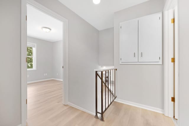 hall with light hardwood / wood-style flooring