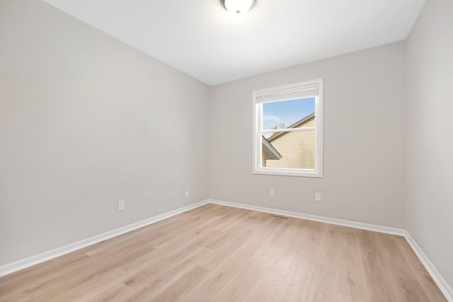 unfurnished room featuring light hardwood / wood-style flooring