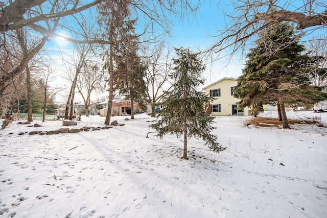 view of yard layered in snow