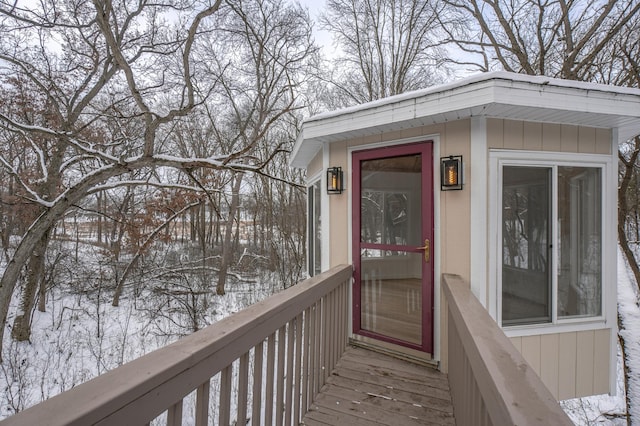 view of snow covered property entrance