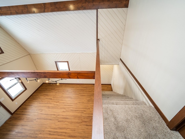 bonus room with lofted ceiling and hardwood / wood-style floors