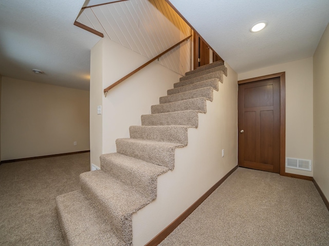 stairway with carpet floors