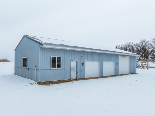 view of snow covered garage