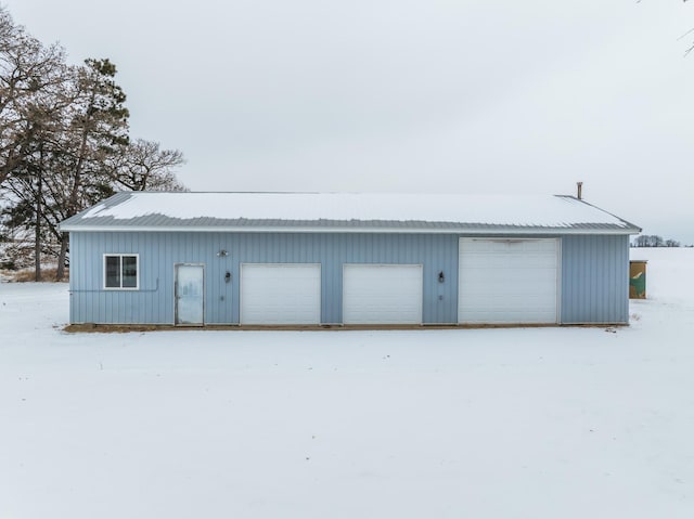 view of snow covered garage