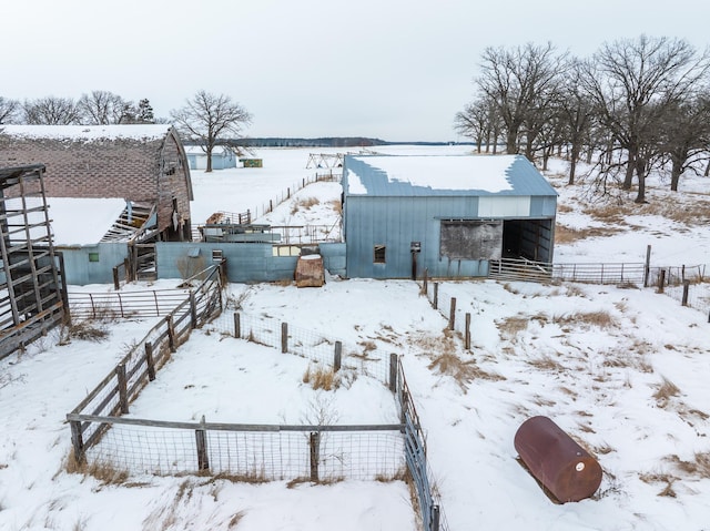 yard covered in snow with an outdoor structure