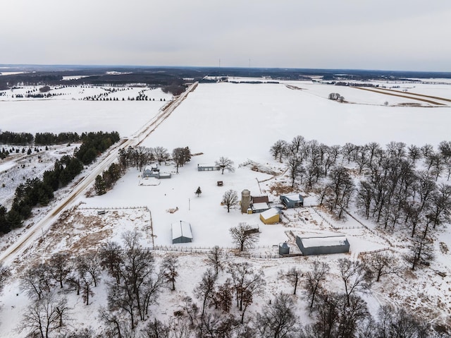 snowy aerial view featuring a rural view