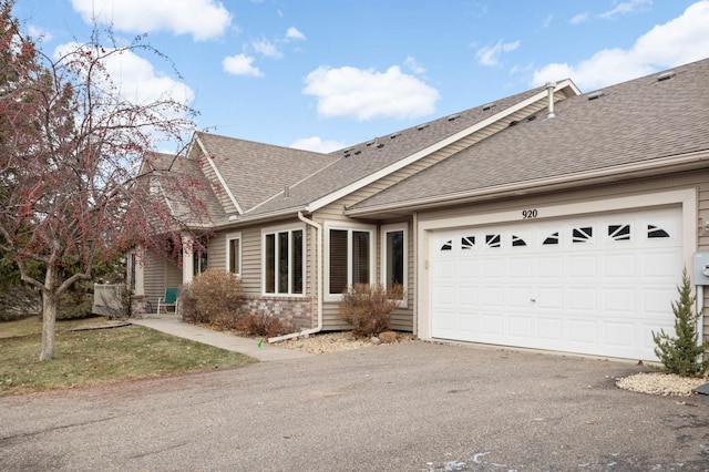 single story home with a garage