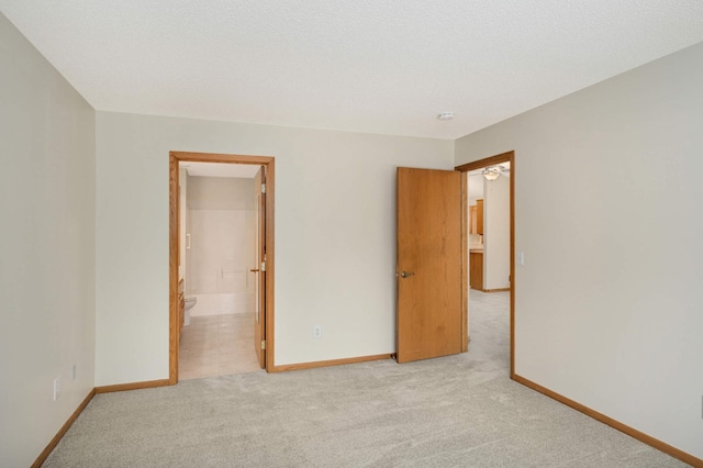 unfurnished room with light colored carpet