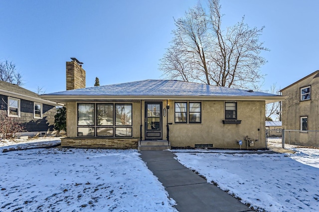 view of snow covered house