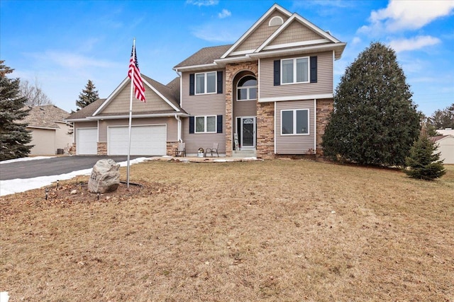 view of front facade with a garage and a front yard