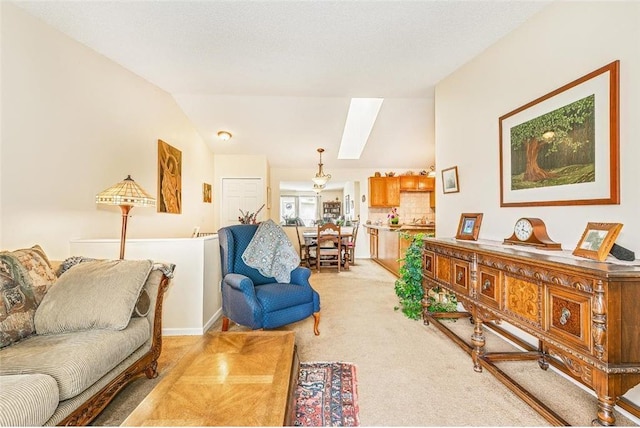 living room with vaulted ceiling, light colored carpet, and a textured ceiling