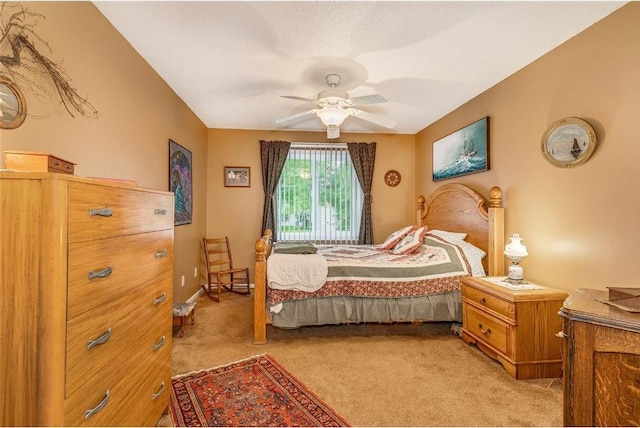 bedroom featuring ceiling fan and light colored carpet