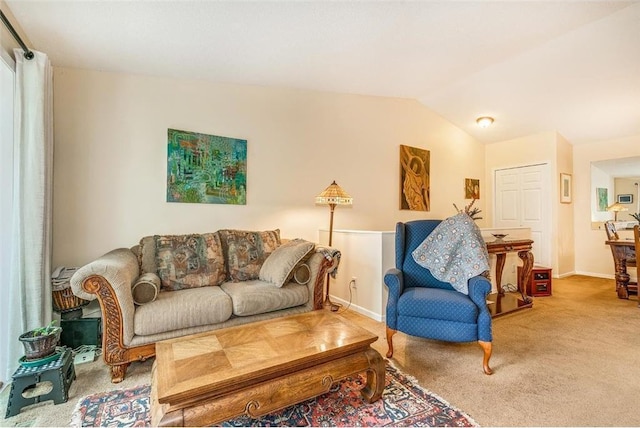 carpeted living room featuring vaulted ceiling