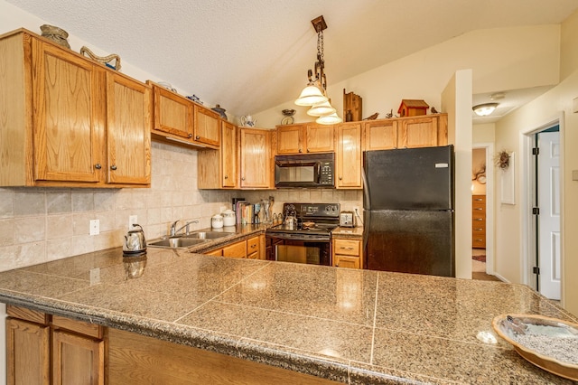 kitchen featuring sink, tasteful backsplash, black appliances, vaulted ceiling, and kitchen peninsula