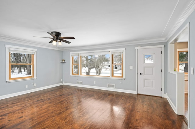 foyer entrance featuring ceiling fan, ornamental molding, and dark hardwood / wood-style floors