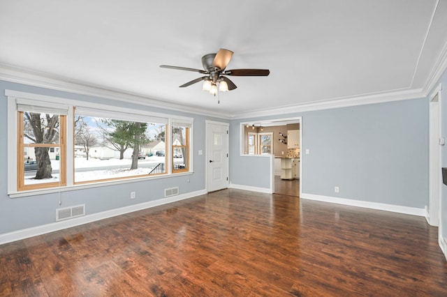 unfurnished living room featuring a wealth of natural light, crown molding, and dark hardwood / wood-style floors