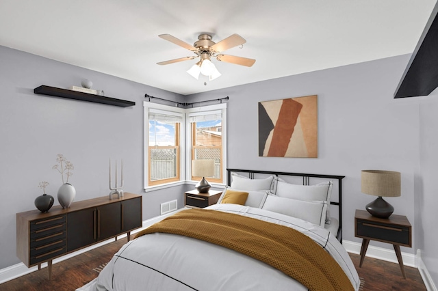 bedroom with ceiling fan and dark wood-type flooring