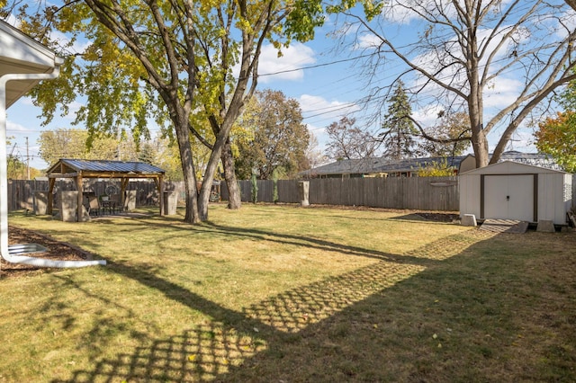 view of yard featuring a storage shed and a gazebo