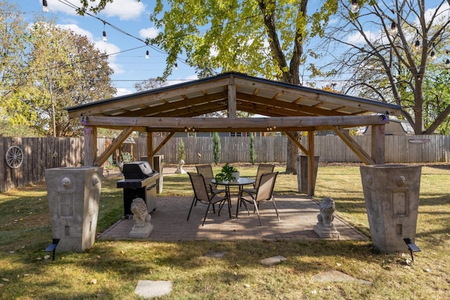 view of home's community featuring a patio and a lawn