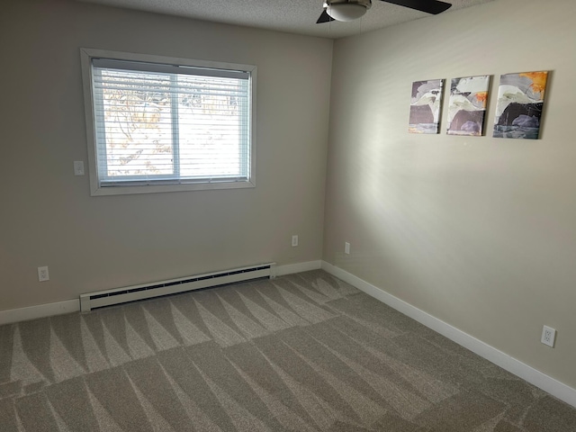 carpeted empty room with baseboard heating, ceiling fan, and a textured ceiling