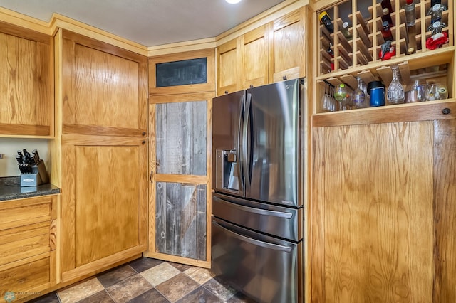 kitchen with stainless steel refrigerator with ice dispenser