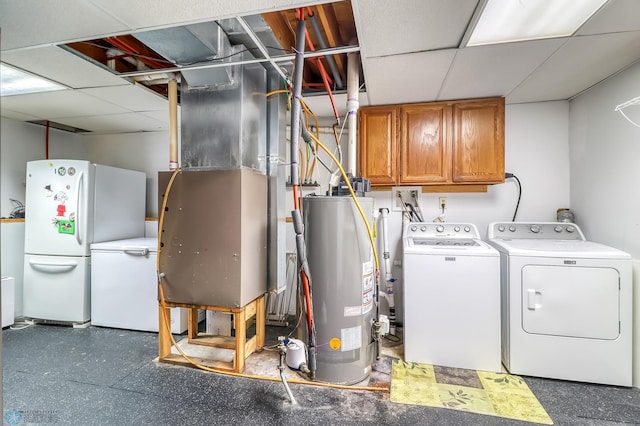 laundry area with cabinets, independent washer and dryer, heating unit, and gas water heater