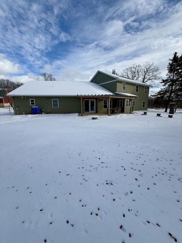 view of snow covered house