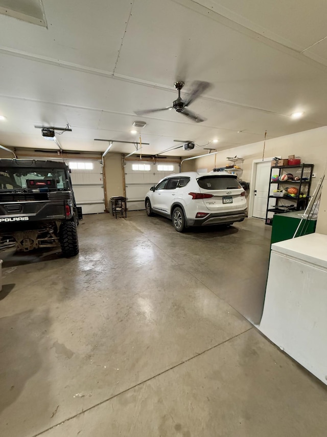 garage with a garage door opener and fridge