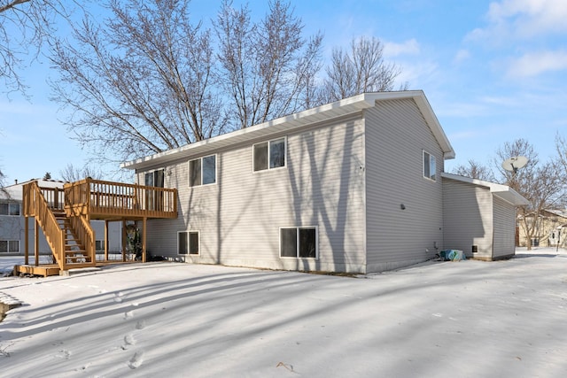 back of house with a wooden deck