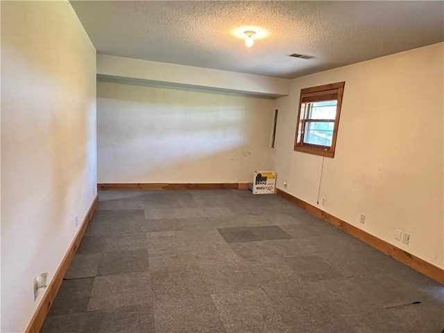 empty room with a textured ceiling