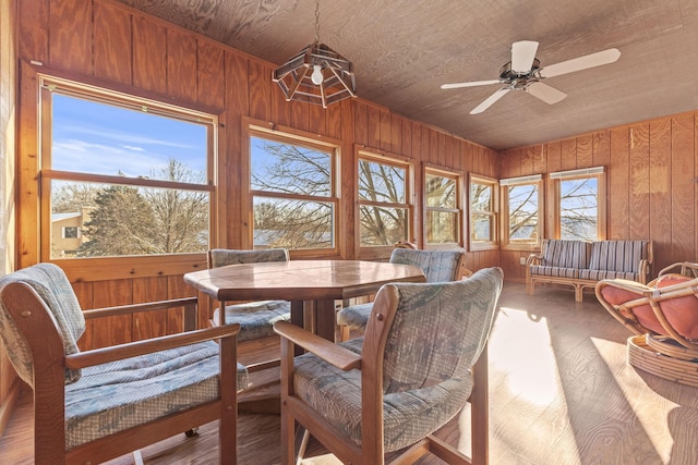 sunroom / solarium featuring wooden ceiling and ceiling fan