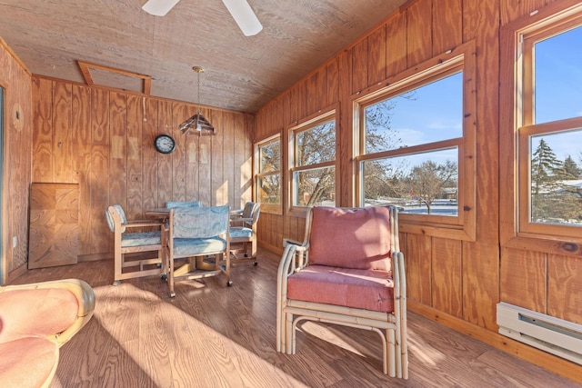 sunroom with wood ceiling, ceiling fan, and baseboard heating