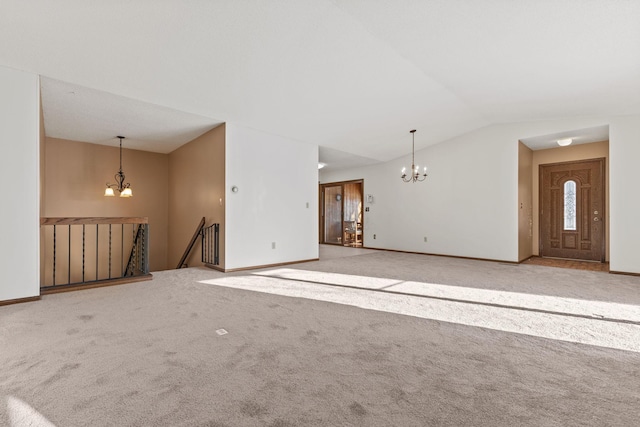 unfurnished living room featuring vaulted ceiling, light colored carpet, and an inviting chandelier