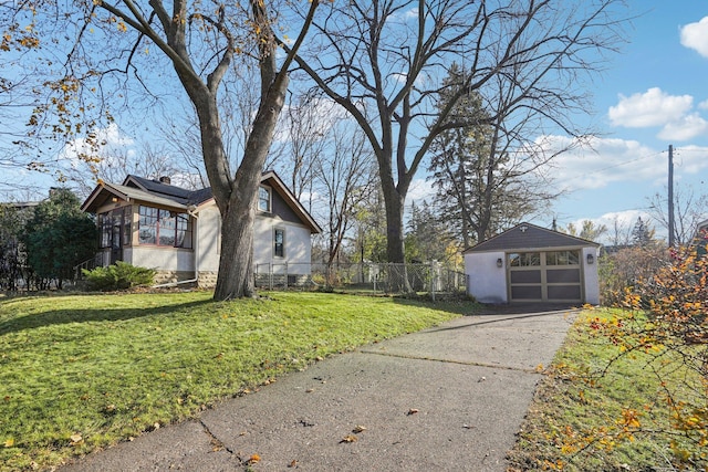 view of home's exterior featuring a garage, a lawn, and an outdoor structure