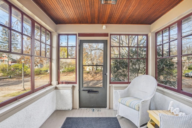 sunroom / solarium featuring wooden ceiling