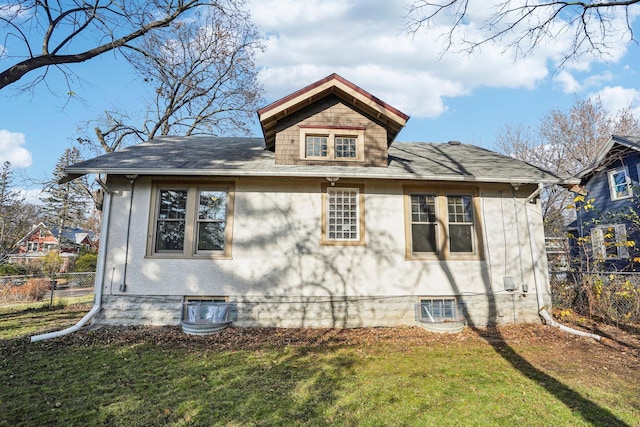 view of home's exterior with a yard