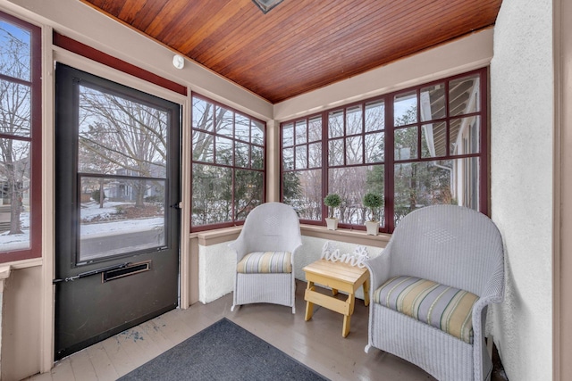 sunroom / solarium featuring wood ceiling