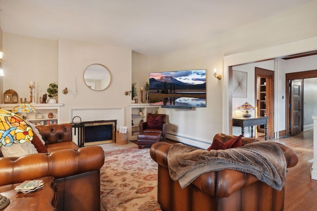 living room featuring hardwood / wood-style flooring and baseboard heating