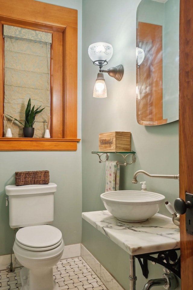 bathroom featuring sink and toilet