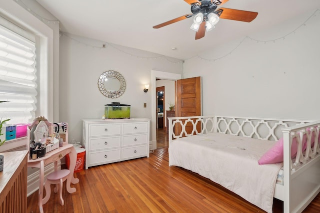 bedroom featuring ceiling fan and light hardwood / wood-style flooring