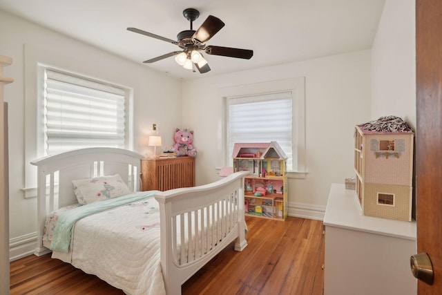 bedroom with wood-type flooring and ceiling fan