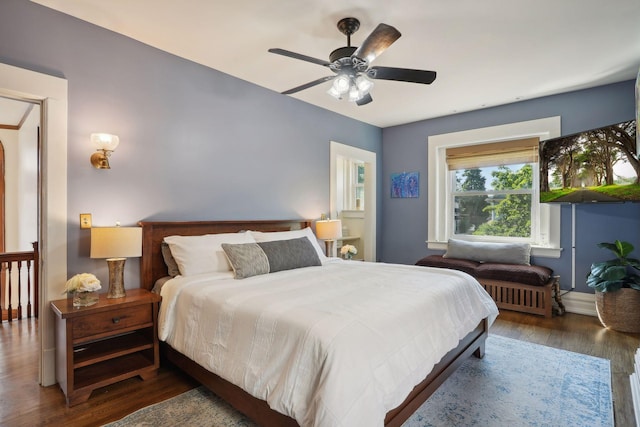 bedroom featuring dark hardwood / wood-style floors and ceiling fan