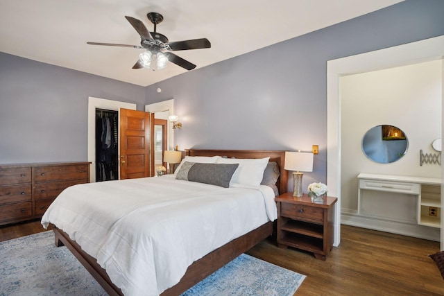 bedroom featuring dark wood-type flooring and ceiling fan