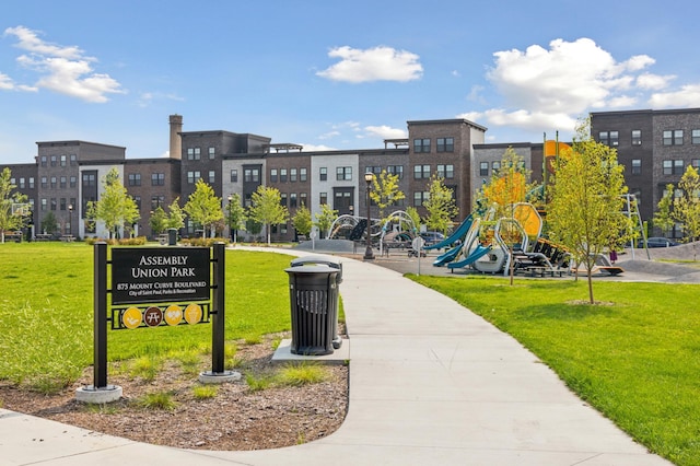 surrounding community with a playground and a yard