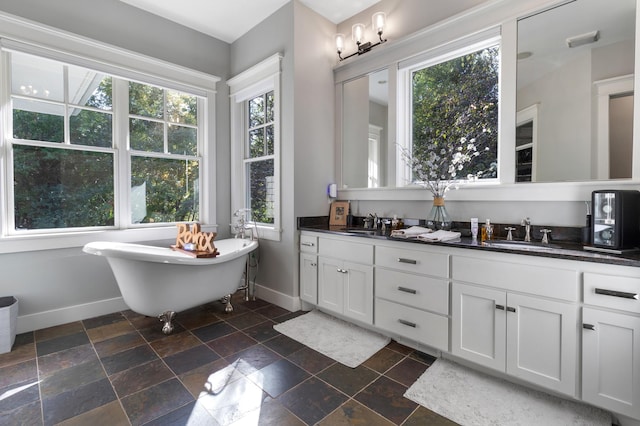 bathroom with vanity and a tub to relax in