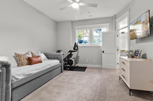 interior space with light carpet and ceiling fan