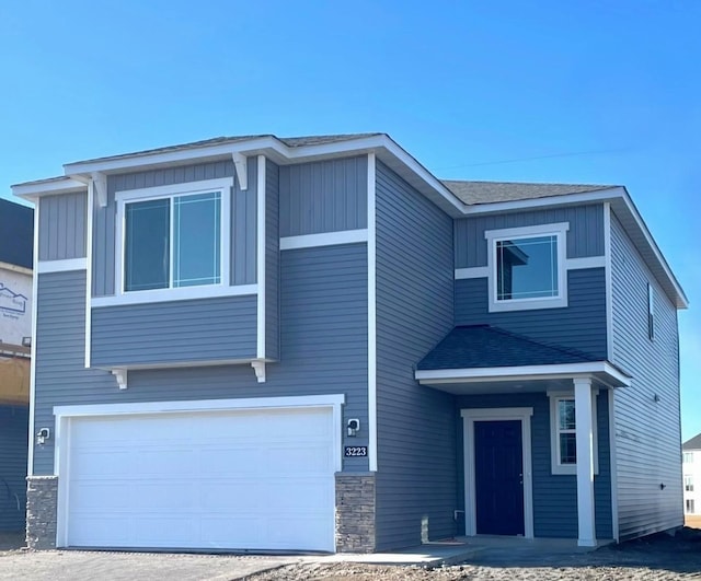 view of front of property with a garage